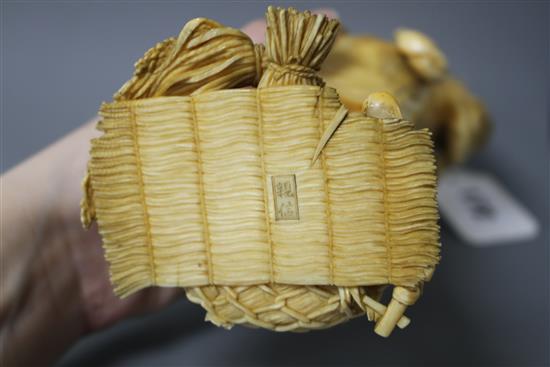 A Japanese Tokyo School ivory okimono, carved as a farmer above a chicken, Meiji period, signed, 24cm